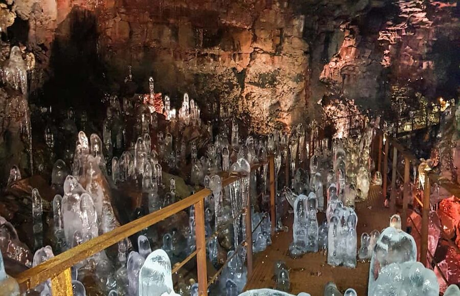 From Reykjavik: Lava Caving Tour - Inside the Cave: Crawling, Rock Formations, and the Lights-Out Moment