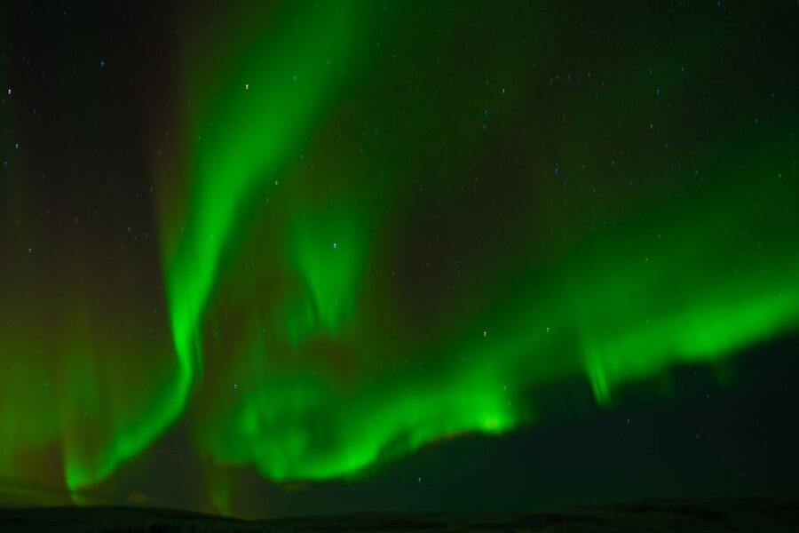 From Reykjavik: Northern Lights Guided Tour with Photos - The guide experience: aurora science, patience, and teamwork