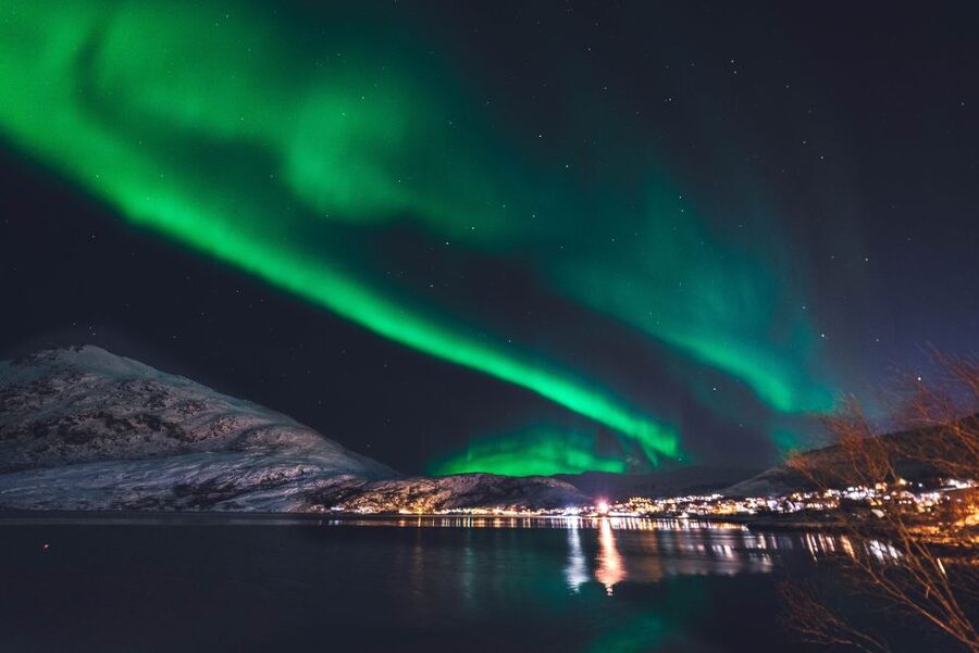 From Reykjavik: Northern Lights Sightseeing Cruise - Reykjavik fading in the rearview mirror, mountains overhead