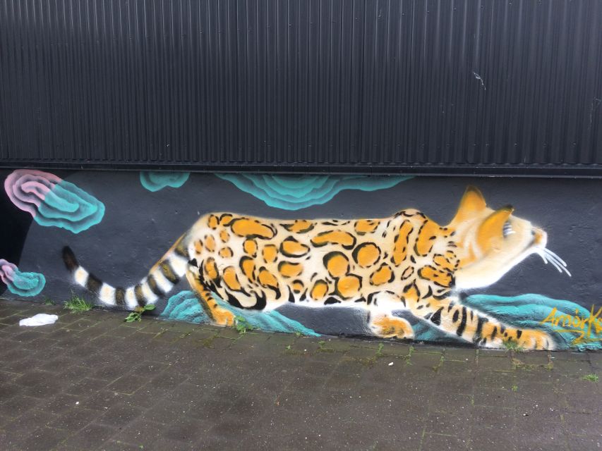 Reykjavik: Guided City Walking Tour - A short pause at Lake Tjornin: snacks, spirits, and a breather