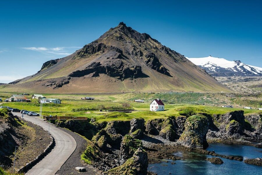 Reykjavik: Snæfellsnes Day Trip with Vatnshellir Lava Cave - Ingjaldshólskirkja: the oldest concrete church stop with glacier views