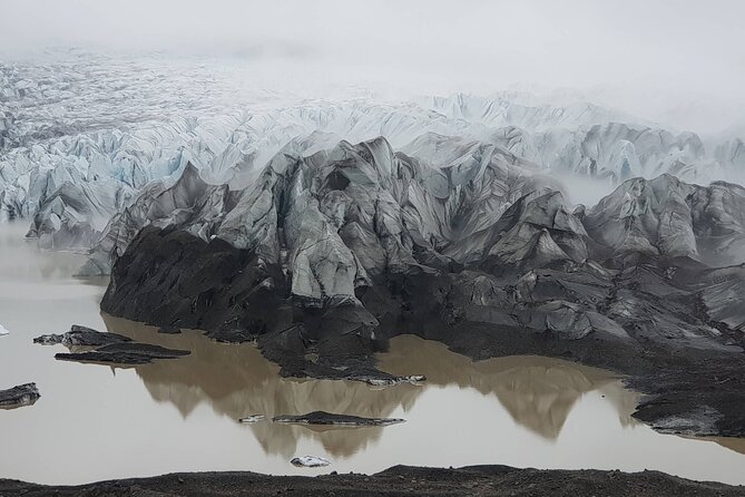 South Coast Waterfall, Black Beach, Glacier Adventure Small Group - Reynisfjara Black Sand Beach and the sea stacks at Reynisdrangar